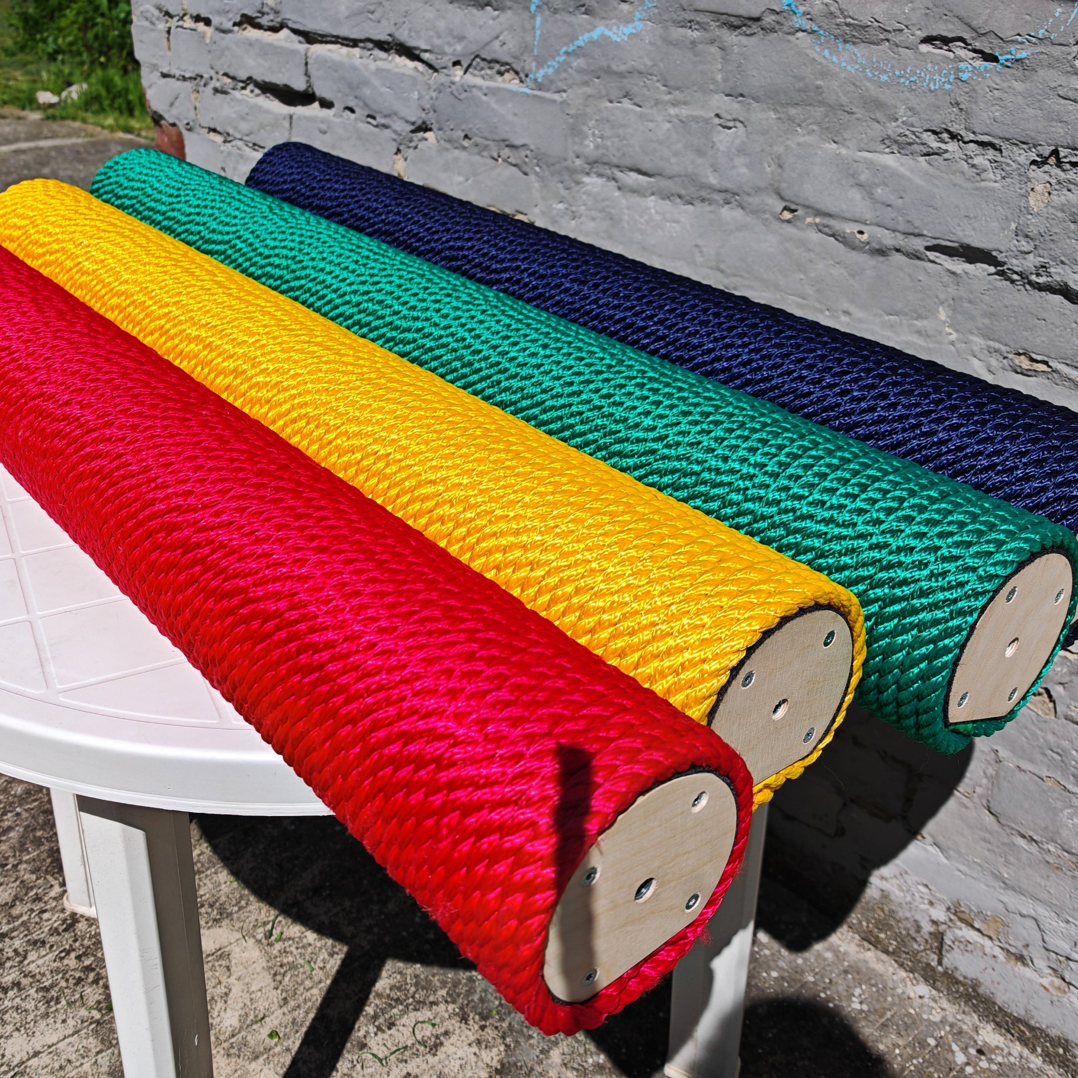 A selection of rope colors for scratching post. Shown are red, yellow, green and blue. 